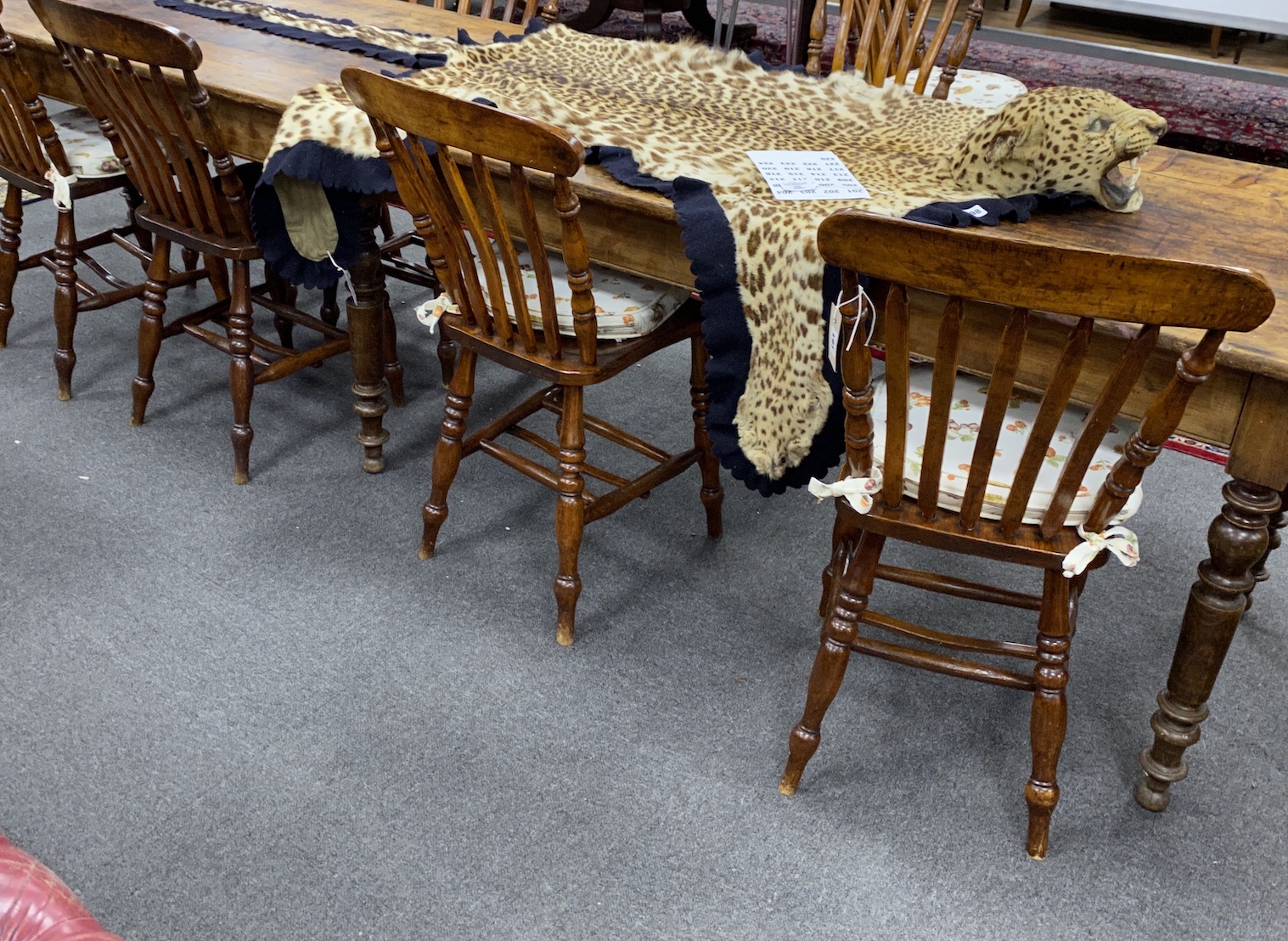 A set of eight Victorian elm and beech Windsor lathe back kitchen chairs, width 37cm, depth 38cm, height 90cm